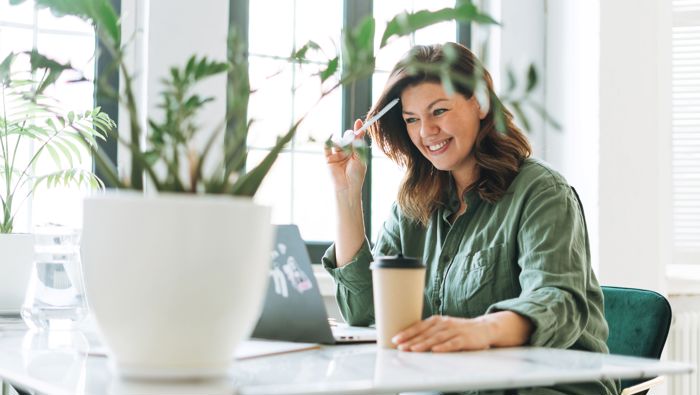 Two men sitting by a table talking